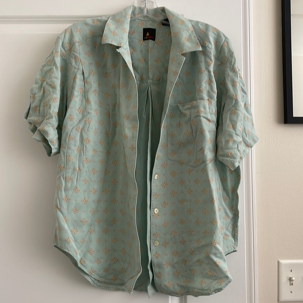 Wear as a cardigan, button-up as a tee, or tie the front for a crop top!